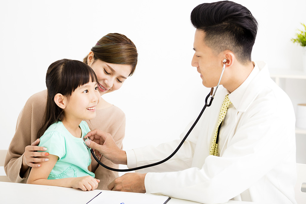 doctor with woman and girl